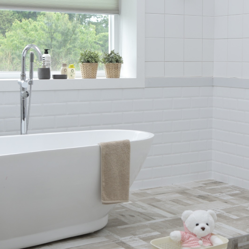 white bathroom tiles with bath